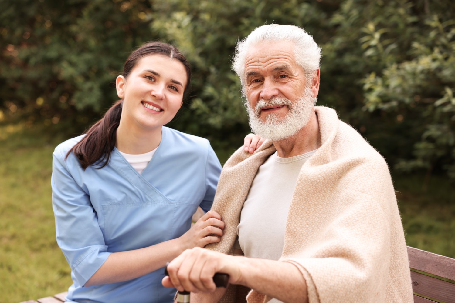 Friendly non-medical caregiver providing compassionate in-home care to elderly client in Hartford, CT