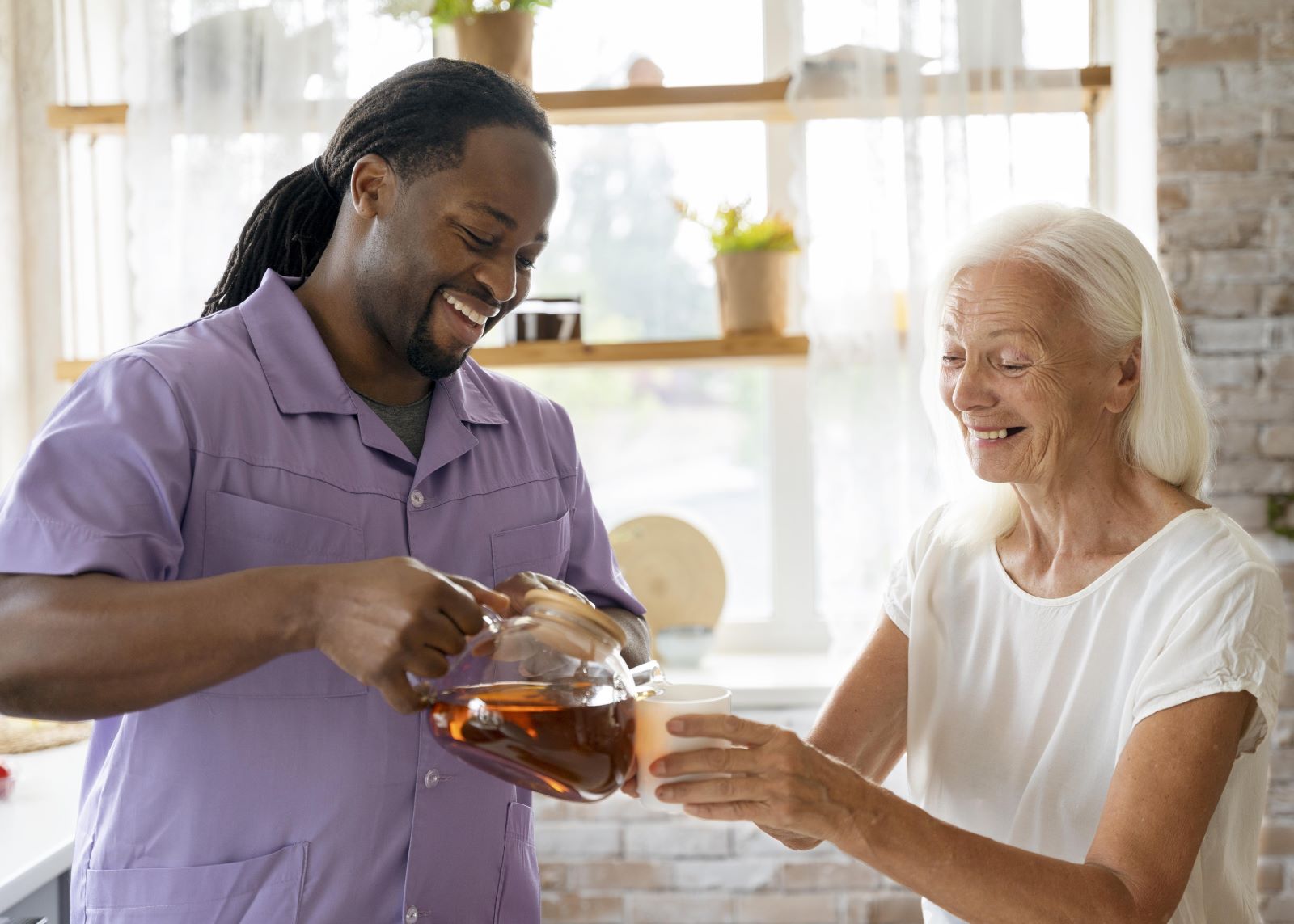 african-social-worker-helping-senior-woman